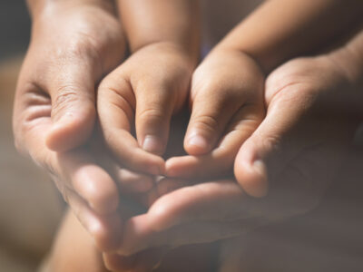 family-praying-indoors